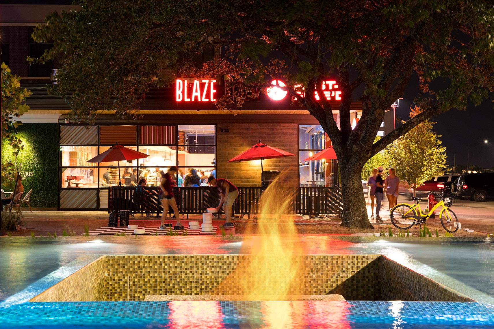 a gas flame and fountain at Century Square in College Station