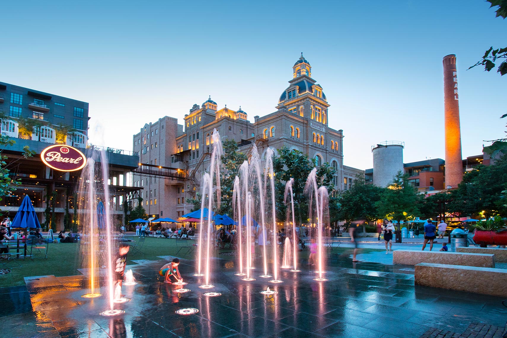 Kids playing in the fountains st the Pearl in San Antonio by Texas Travel Photographer Shannon O
