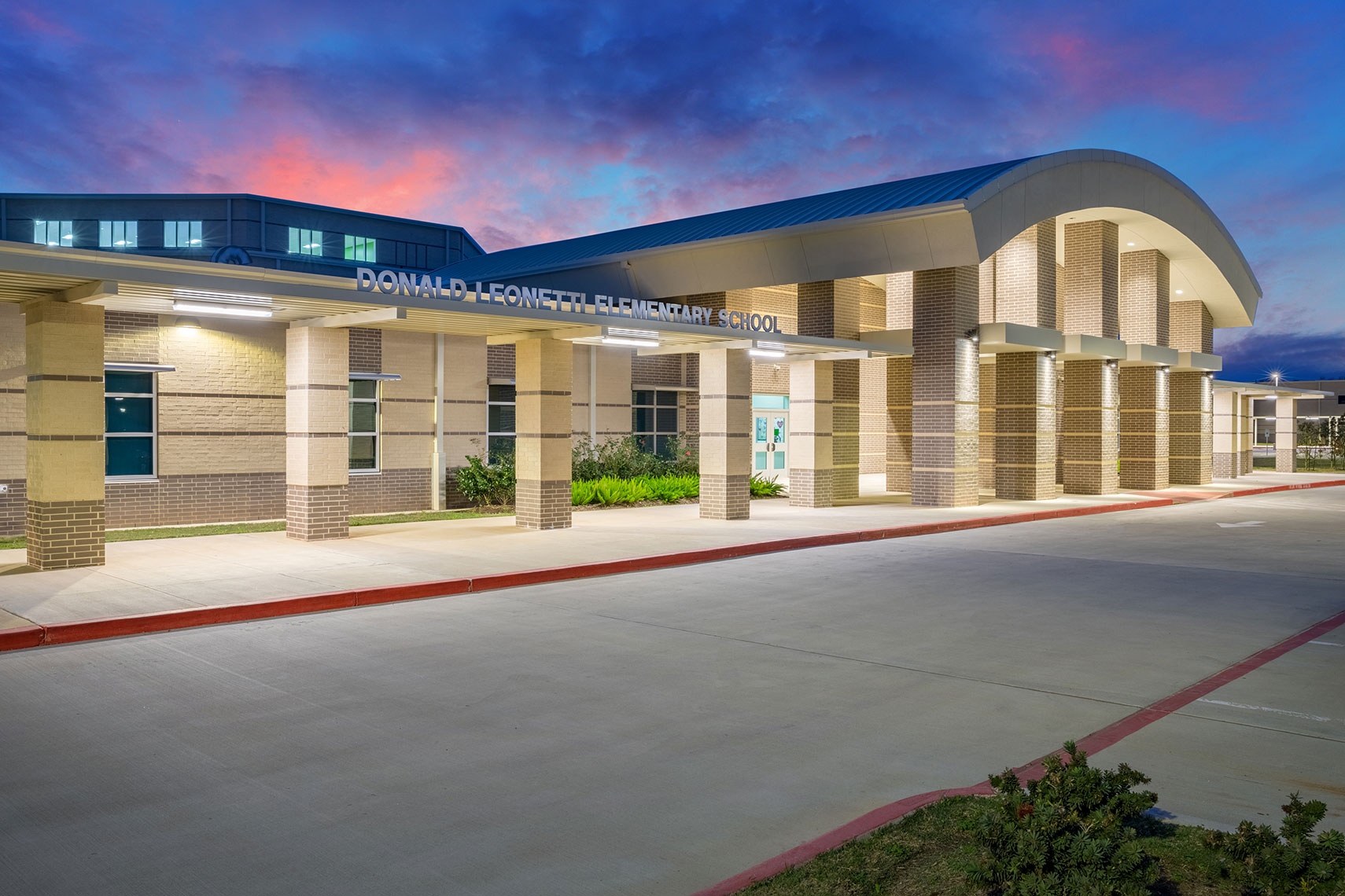 a newly constructed Texas school at sunset by best education architecture photographer