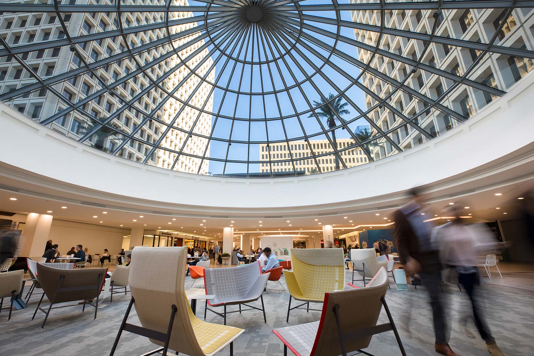 a view of office buildings through large circular skylight at Greenway Plaza in Houston by Architectural photographer