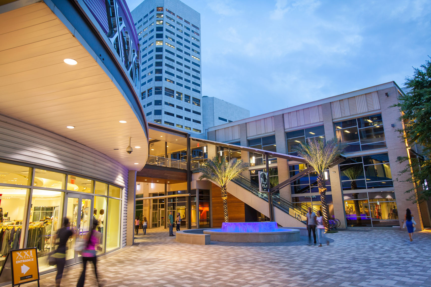 shoppers walking past the front entrance of GreenStreet in Downtown Houston. Texas